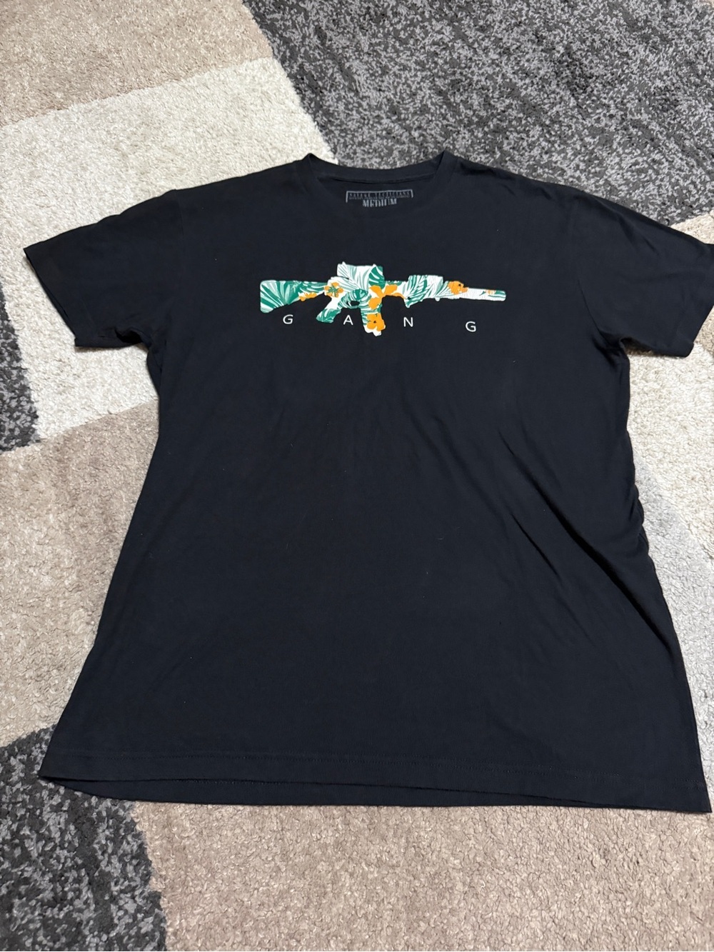Savage Tacticians Tropo Gang Black Graphic MediumT-Shirt with floral rifle Print